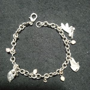 7" silver tone charm bracelet.